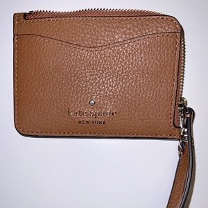 Kate Spade small card holder with strap and zipper pocket.